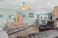 316 NE 52nd Street, Oak Island, NC 28465 — 3-bedroom home in Tranquil Harbor, Oak Island, NC, photo 8 of 49: 14_living room