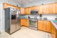 1131 S Shore Drive, Surf City, NC 28445 — 4-bedroom waterfront home in Horse Hammock, Surf City, NC, photo 5 of 40: Kitchen III