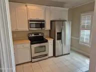 4228 Belgreen Drive, Rocky Mount, NC 27804 — 2-bedroom townhome in Fairfield Village, Rocky Mount, NC, photo 6 of 15: Kitchen Other view
