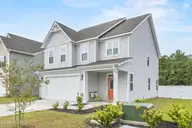 1080 Ben Thomas Drive NE, Leland, NC 28451 — 4-bedroom home in Coastal Haven, Leland, NC, photo 3 of 45: Front Exterior (45)
