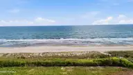 105 Ocean Promenade, Indian Beach, NC 28512 — 5-bedroom waterfront home in The Pearls Oceanside, Indian Beach, NC, photo 16 of 17: 14-print-DJI_20260505165256_0894_D