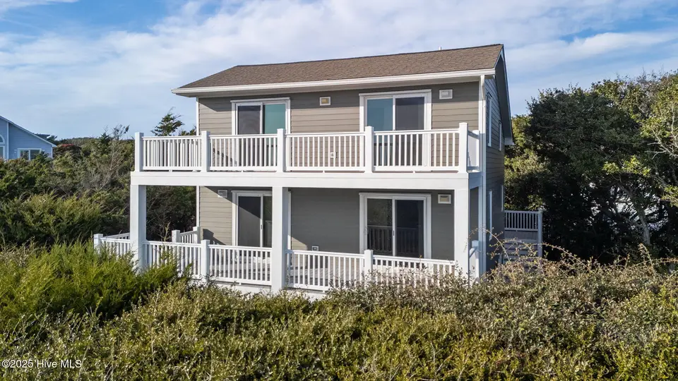 100 Conch Court, Emerald Isle, NC 28594 — 4-bedroom waterfront home in Sea Dunes, Emerald Isle, NC, photo 1 of 53: 2-web-or-mls-DJI_20251113150204_0939_D