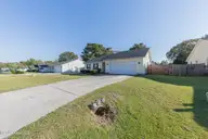 108 Pollard Drive, Jacksonville, NC 28540 — 4-bedroom home in Gateway, Jacksonville, NC, photo 2 of 74: Front
