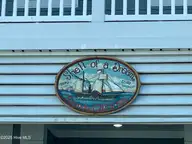 7 Coggeshall Drive W, Ocean Isle Beach, NC 28469 — 6-bedroom waterfront home in West Ocean Palms, Ocean Isle Beach, NC, photo 4 of 77: A Shell of a Dream