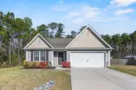238 Poppleton Drive, Hampstead, NC 28443 — 3-bedroom home in Harrison Cove, Hampstead, NC, photo 1 of 43: m_1_front exterior