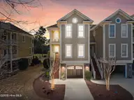489 River Bluff Drive Unit 1, Shallotte, NC 28470 — 4-bedroom townhome in Rivers Edge, Shallotte, NC, photo 1 of 75: 1-web-or-mls-DJI_20260119125956_0155_Dx