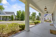 321 Jenoa Drive, Castle Hayne, NC 28429 — 3-bedroom home in River Bluffs, Castle Hayne, NC, photo 4 of 68: 4_front patio