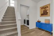 239 Seneca Reef Drive, Hampstead, NC 28443 — 3-bedroom home in Seneca Reef, Hampstead, NC, photo 5 of 39: Staircase and Laundry