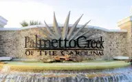 1237 Mandevilla Drive SE, Bolivia, NC 28422 — 4-bedroom home in Palmetto Creek, Bolivia, NC, photo 6 of 39: Palmetto Creek Sign