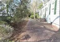 2856a Forest Hills Loop SW, Wilson, NC 27893 — 3-bedroom waterfront home, Wilson, NC, photo 18 of 58: 18 _ Brick Patio on Lake Side of Home