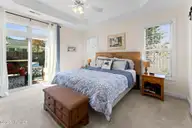 1013 Garden Club Way, Leland, NC 28451 — 3-bedroom home in Waterford of the Carolinas, Leland, NC, photo 12 of 34: Primary Glass Doors