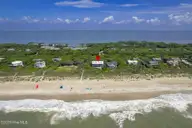 585 Forest Dunes Drive, Pine Knoll Shores, NC 28512 — 4-bedroom waterfront home in Beacon's Reach, Pine Knoll Shores, NC, photo 1 of 68: Oceanfront home in Beacon's Reach