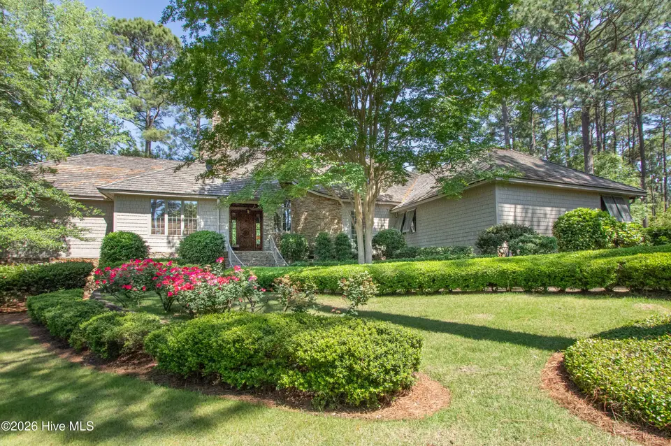 60 Woodenbridge Lane, Pinehurst, NC 28374 — 4-bedroom waterfront home in National, Pinehurst, NC, photo 1 of 76: FrontExterior1-2