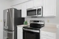 312 Wendover Lane, Wilmington, NC 28411 — 3-bedroom home in Wendover, Wilmington, NC, photo 12 of 35: Kitchen-Stove+Fridge