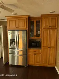 515 Fairway Drive W, Sunset Beach, NC 28468 — 3-bedroom home in Sea Trail Plantation, Sunset Beach, NC, photo 13 of 25: Kitchen pantry cabinets