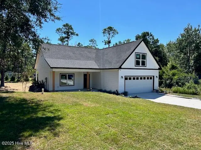1996 E Boiling Spring Road, Southport, NC 28461 — 3-bedroom home in Boiling Spring Lakes, Southport, NC, photo 1 of 42: Front 2