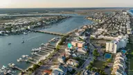 110 Waynick Boulevard, Wrightsville Beach, NC 28480 — 4-bedroom waterfront home, Wrightsville Beach, NC, photo 9 of 77: 006_dji_20260504192322_0446_d_755