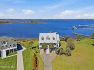 5 Osprey Circle, North Topsail Beach, NC 28460 — 3-bedroom waterfront home in Crystal Shores, North Topsail Beach, NC, photo 2 of 79: 3_front center aerial