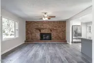 255 Foxcroft Road, Whispering Pines, NC 28327 — 3-bedroom home, Whispering Pines, NC, photo 5 of 31: Living Room with Fireplace