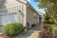 6463 Timber Hitch Drive SW, Ocean Isle Beach, NC 28469 — 3-bedroom waterfront home in Waterway Cove, Ocean Isle Beach, NC, photo 9 of 50: Garage Street Side