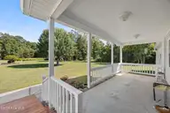 195 Calabash Road NW, Calabash, NC 28467 — 3-bedroom manufactured home in Carolina Shores, Calabash, NC, photo 5 of 37: Covered Front Porch