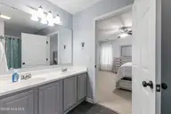 1803 W Yacht Drive, Oak Island, NC 28465 — 3-bedroom home in Pinners Point, Oak Island, NC, photo 21 of 39: En-suite