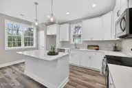 9575 Lily Pond Court NE, Leland, NC 28451 — 4-bedroom home in Lily Pond, Leland, NC, photo 7 of 37: Large breakfast bar