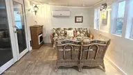 2495 Barracuda Street SW, Supply, NC 28462 — 2-bedroom manufactured home in Sandy Shoals, Supply, NC, photo 4 of 54: Enclosed Porch = 2nd Living Area