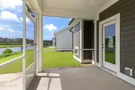 212 Windswept Lane, Beaufort, NC 28516 — 4-bedroom home in Beaufort Club, Beaufort, NC, photo 18 of 49: Screened in Porch