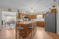 1601 River Bluff Road, Morehead City, NC 28557 — 3-bedroom waterfront home in South Shores, Morehead City, NC, photo 4 of 32: Kitchen and dining view