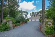 1064 Tresses Court, Vass, NC 28394 — 4-bedroom waterfront home in Woodlake, Vass, NC, photo 8 of 50: Side Entry