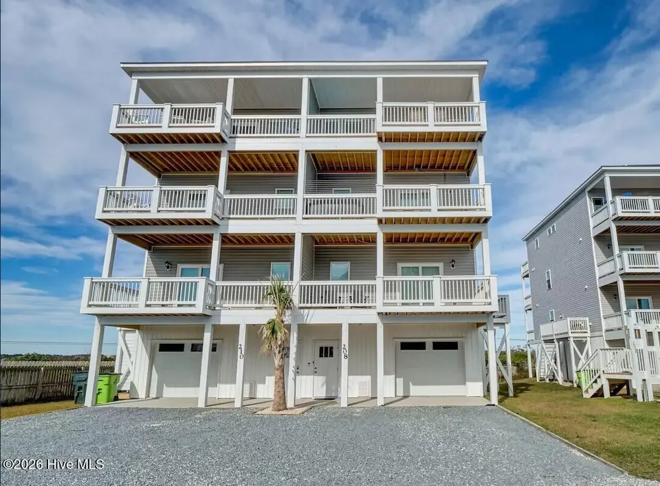 208 Goldsboro Drive, North Topsail Beach, NC 28460 — 6-bedroom waterfront townhome in Topsail Wynds, North Topsail Beach, NC, photo 1 of 51: front