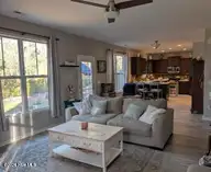 114 Lumis Court, Hampstead, NC 28443 — 4-bedroom home in Dogwood Lakes, Hampstead, NC, photo 12 of 26: open living