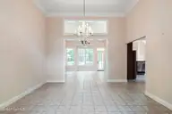 86 Plantation Passage Drive SE, Bolivia, NC 28422 — 4-bedroom waterfront home in Winding River Plantation, Bolivia, NC, photo 5 of 77: Dining Room