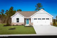 4065 Farmfield Drive, Navassa, NC 28451 — 3-bedroom home in Lakes at Riverbend, Navassa, NC, photo 1 of 22