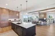 26 Solstice Way, Hampstead, NC 28443 — 4-bedroom waterfront home in East Wynd, Hampstead, NC, photo 19 of 55: Kitchen overlooking Family Room