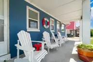 207 E Terminal Boulevard, Atlantic Beach, NC 28512 — 4-bedroom waterfront home, Atlantic Beach, NC, photo 4 of 68: Front Porch View