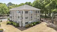 213 Kings Trail # 1004, Sunset Beach, NC 28468 — 2-bedroom condo in Sea Trail Plantation, Sunset Beach, NC, photo 3 of 52: 32_drone