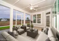 105 Windswept Lane, Beaufort, NC 28516 — 4-bedroom home in Beaufort Club, Beaufort, NC, photo 4 of 45: Spacious Screened Porch