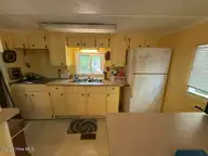 104 River Road, Blounts Creek, NC 27814 — 2-bedroom waterfront manufactured home in Crystal Beach, Blounts Creek, NC, photo 10 of 13: Kitchen