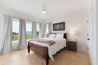 855 Cannonsgate Drive, Newport, NC 28570 — 4-bedroom waterfront home in Cannonsgate, Newport, NC, photo 16 of 55: First floor bedroom with porch access