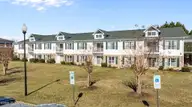 510 Little River Farm Boulevard 106b, Carthage, NC 28327 — 2-bedroom condo in Little River Fa, Carthage, NC, photo 1 of 22: Porch side of condo units