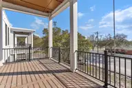 805 Mulberry Street 206, Beaufort, NC 28516 — 2-bedroom condo in 805 Mulberry, Beaufort, NC, photo 13 of 22: Porch with Views of Live Oaks