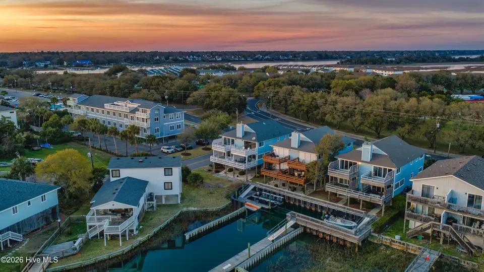 304 Causeway Drive Unit A, Wrightsville Beach, NC 28480 — 3-bedroom waterfront condo in Windswept, Wrightsville Beach, NC, photo 1 of 52: 001_dji_20260319192304_0731_d_copy_664