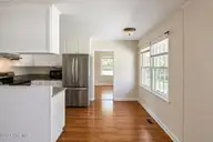 2903 Dare Court, New Bern, NC 28562 — 3-bedroom home in Colony Estates, New Bern, NC, photo 6 of 33: Family Room into Kitchen
