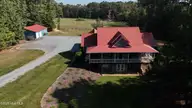 104 Bridle Path Lane, Carthage, NC 28327 — 3-bedroom waterfront home in Carolina Equest, Carthage, NC, photo 2 of 64: DJI_20250924103612_0284_D