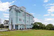 825 S Topsail Drive, Surf City, NC 28445 — 6-bedroom waterfront home in Yow Poisson, Surf City, NC, photo 1 of 74