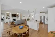 145 W Keel Drive, Hampstead, NC 28443 — 3-bedroom home in Salters Haven at Lea Marina, Hampstead, NC, photo 10 of 57: open kitchen living area and dining