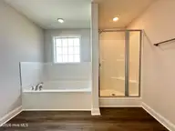 1067 Lexington Avenue NE, Leland, NC 28451 — 4-bedroom home in Parkwood Estates, Leland, NC, photo 7 of 32: 1067 Lexington Primary Suite Bath