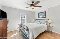166 NE 5th Street, Oak Island, NC 28465 — 3-bedroom home in Tranquil Harbor, Oak Island, NC, photo 23 of 59: 20_primary bedroom